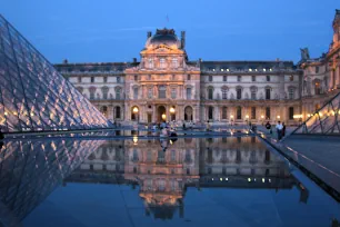 The Louvre reflected in a pool